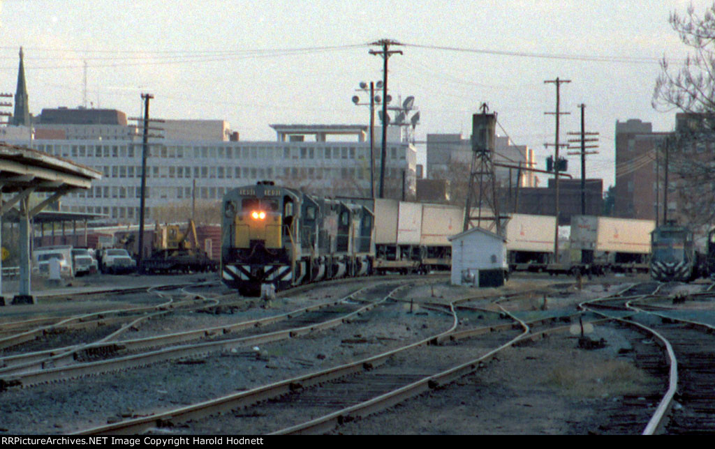 SBD 1491 (former L&N unit) leads a northbound piggyback train past the station